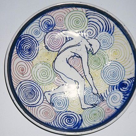"Spiral Man" 14" across - clear glaze over coloured slips -  sgraffito